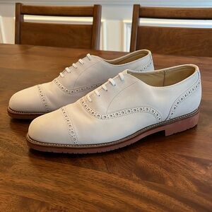 Top quality men’s classic brogue cap toe Oxford with brick red sole.